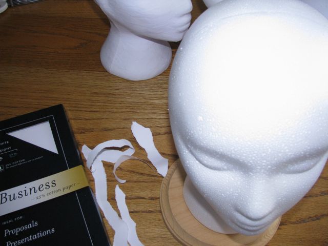 head covered with paper maché